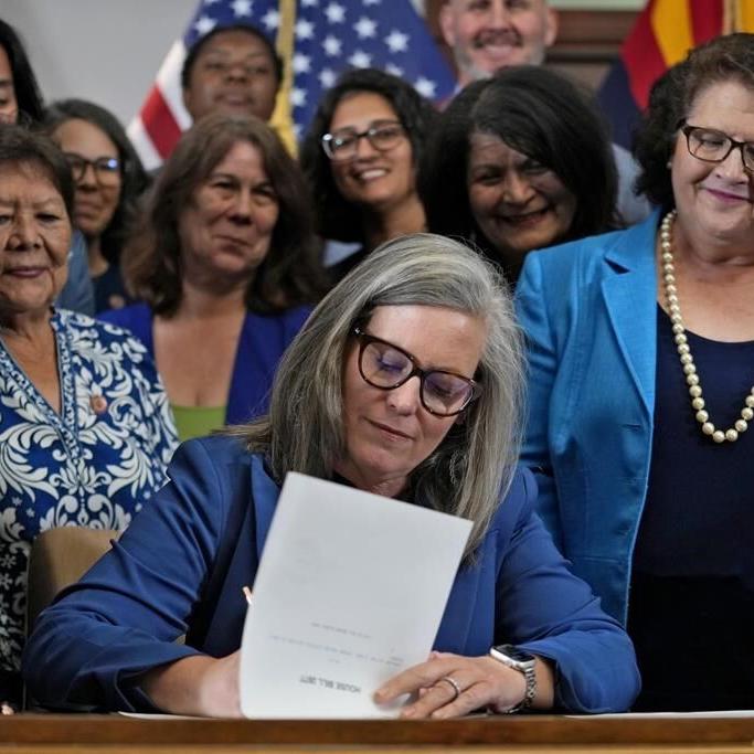 Arizona governor's signing of abortion law repeal follows political fight by women lawmakers